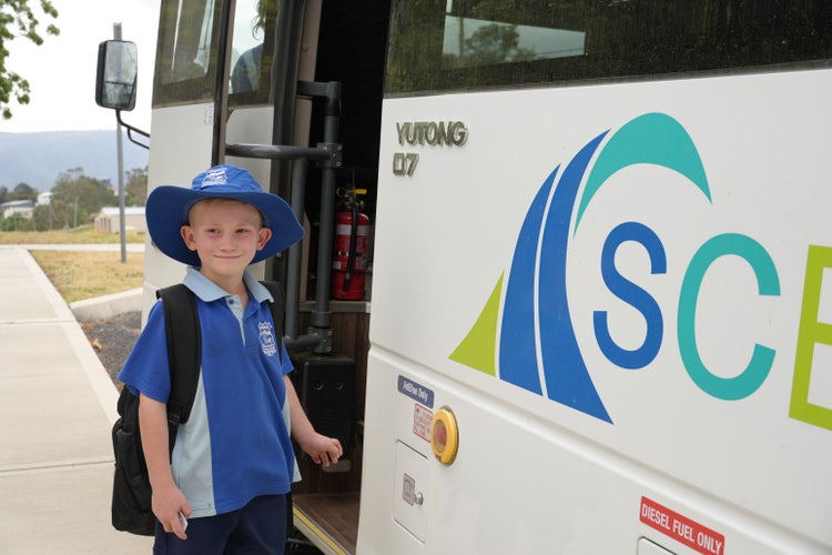 student getting on the school bus