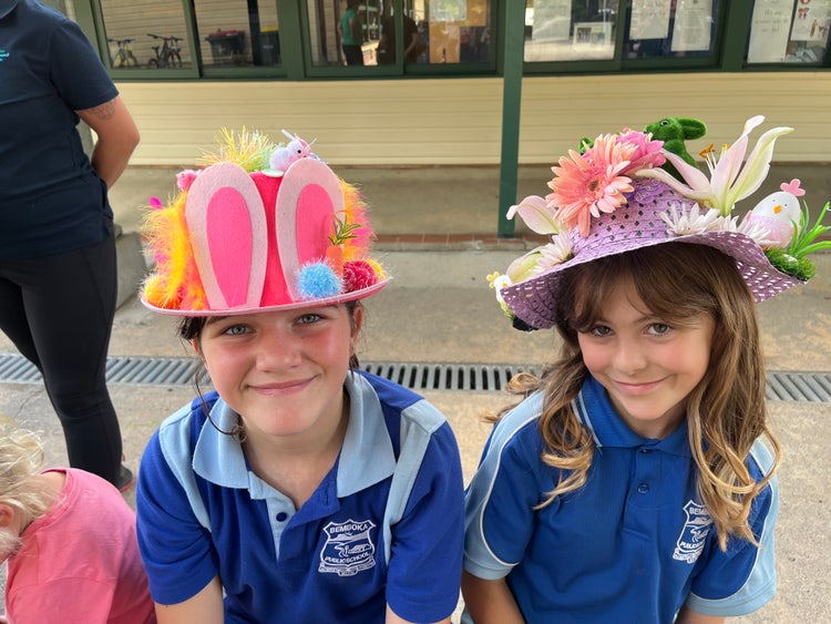 two students wearing easter hats