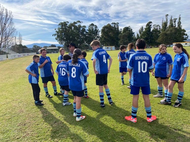 school sports team on the oval
