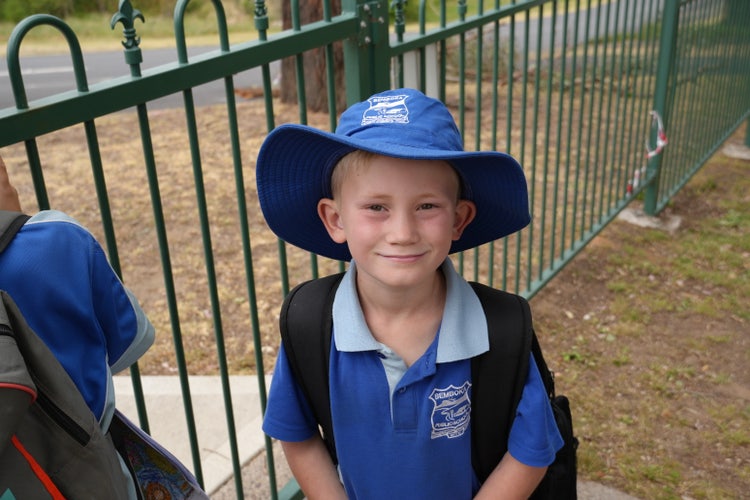 student at the school gate