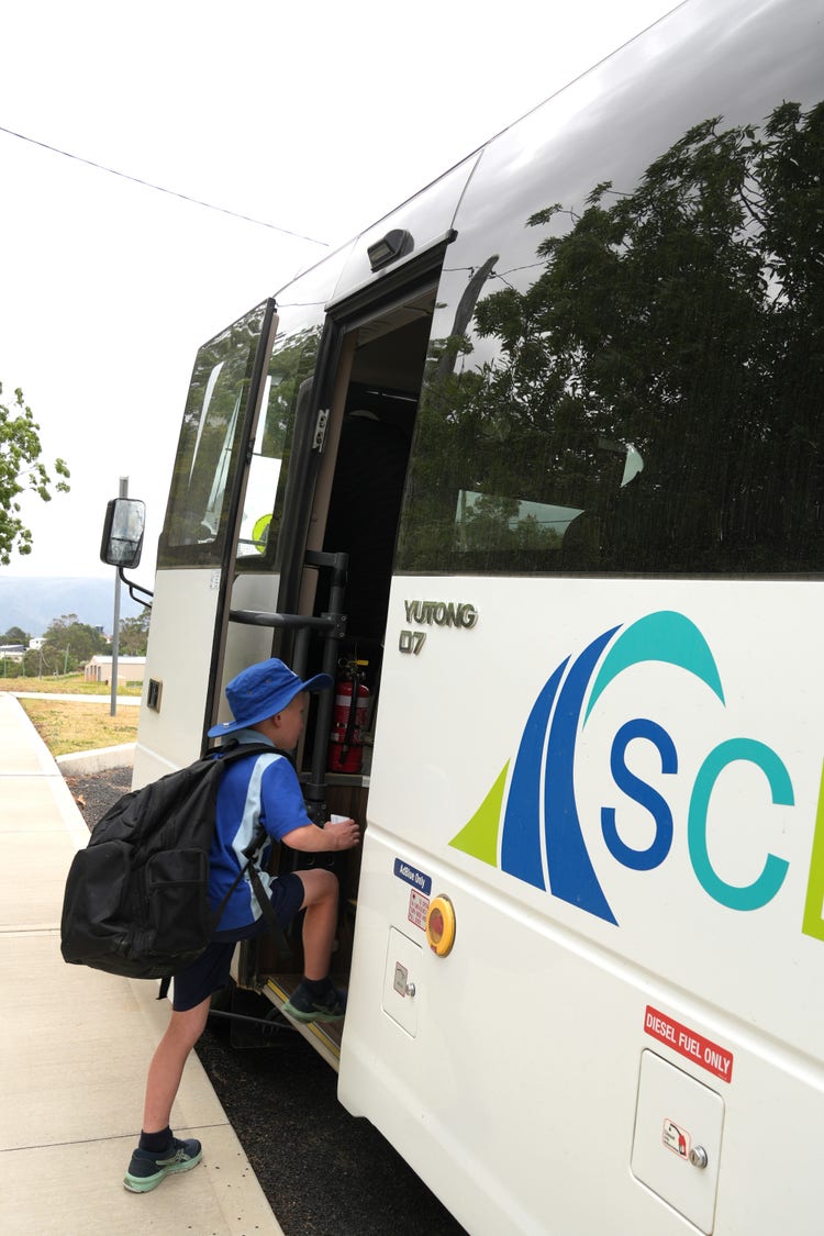 student boarding the school bus